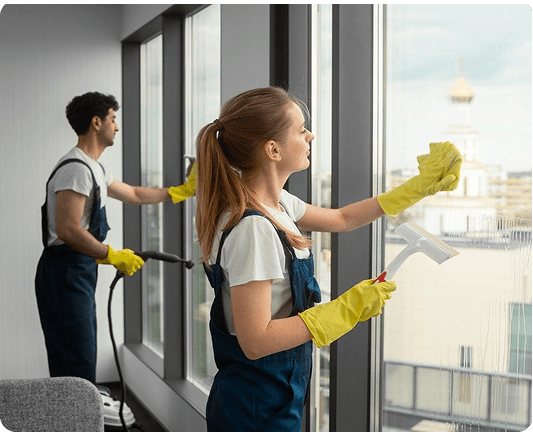 Professional cleaning team working on windows